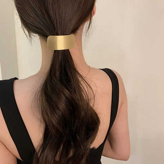 Goma para el pelo de metal dorado
