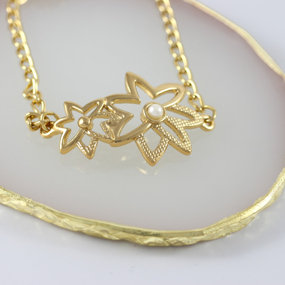 Pulsera de mujer con flores bañada en oro real de 24 quilates