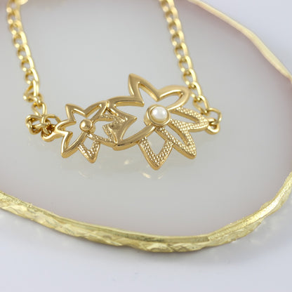 Pulsera de mujer con flores bañada en oro real de 24 quilates
