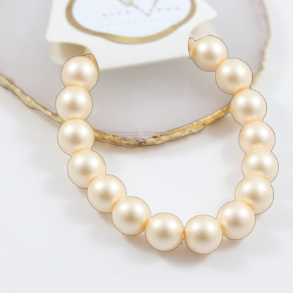 Pulsera elástica de perlas de color salmón
