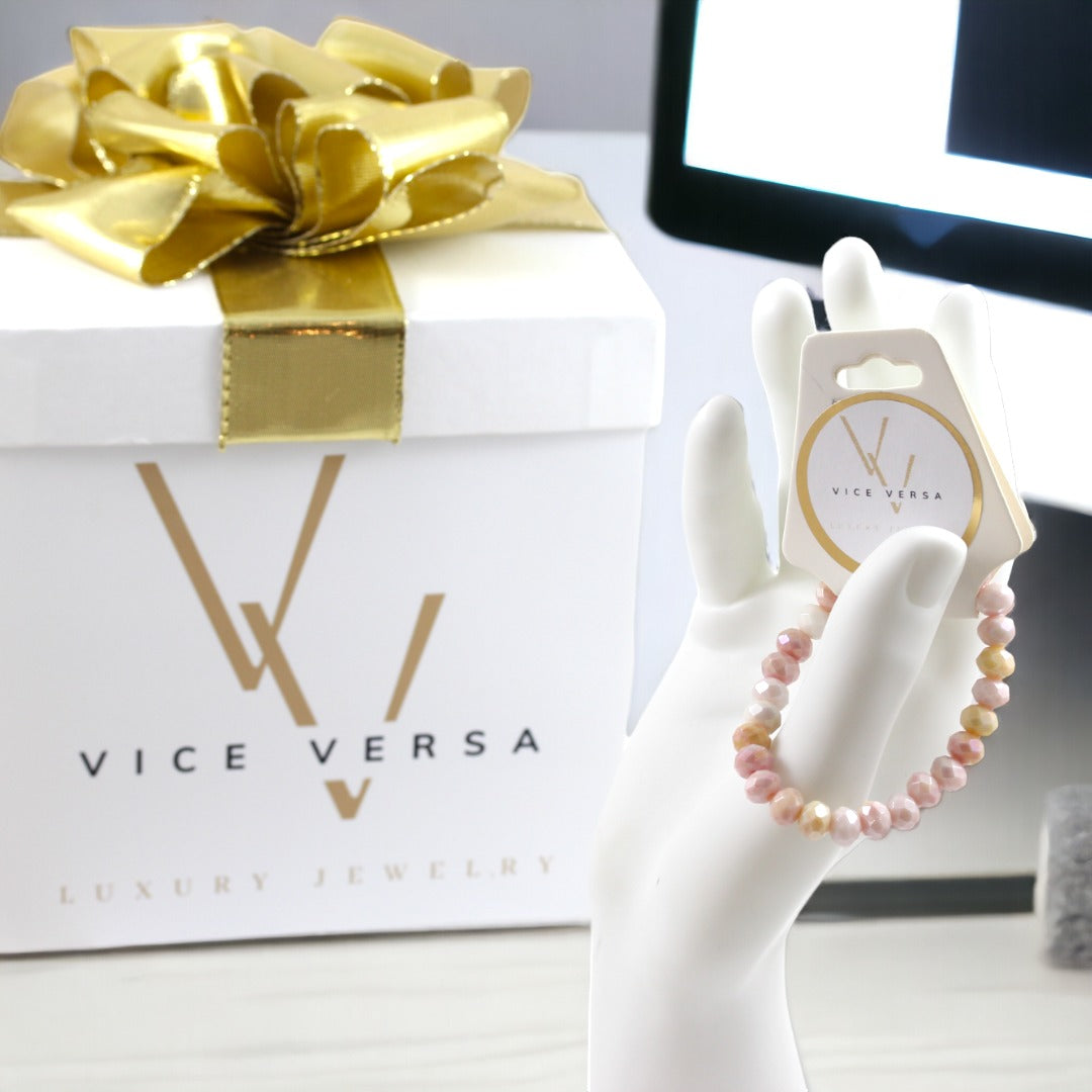Pulsera elástica con cuentas de cristal de color rosa y amarillo