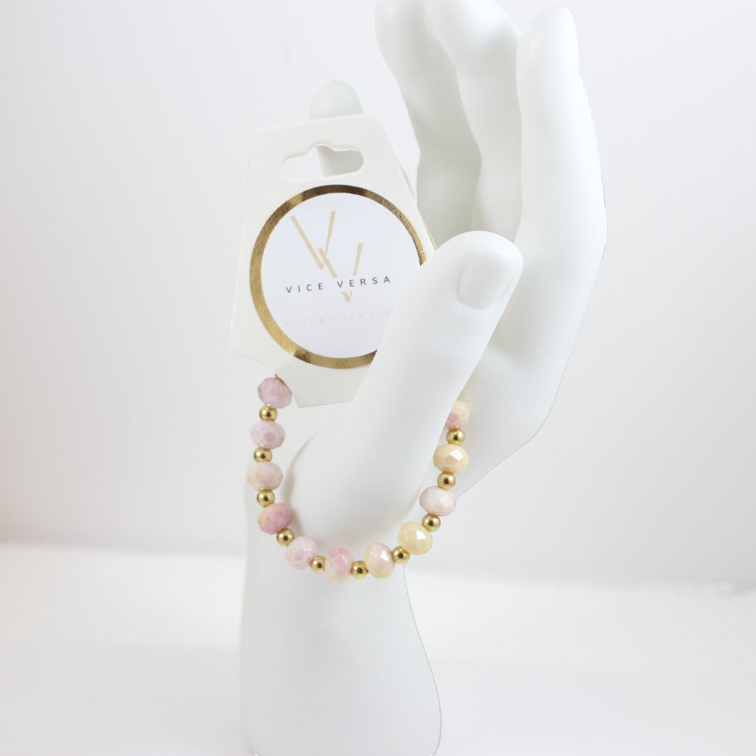 Pulsera elástica con cuentas de cristal de color rosa y amarillo
