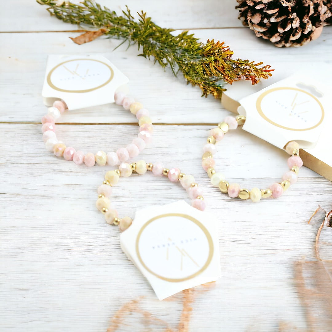Pulsera elástica con cuentas de cristal de color rosa y amarillo